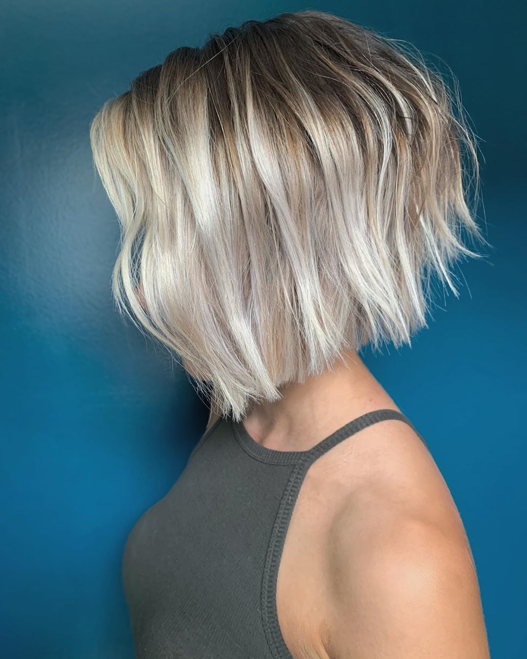 Rocking a chic platinum bob that exudes elegance and modern flair! This stunning blonde hairstyle is perfect for making a bold statement.