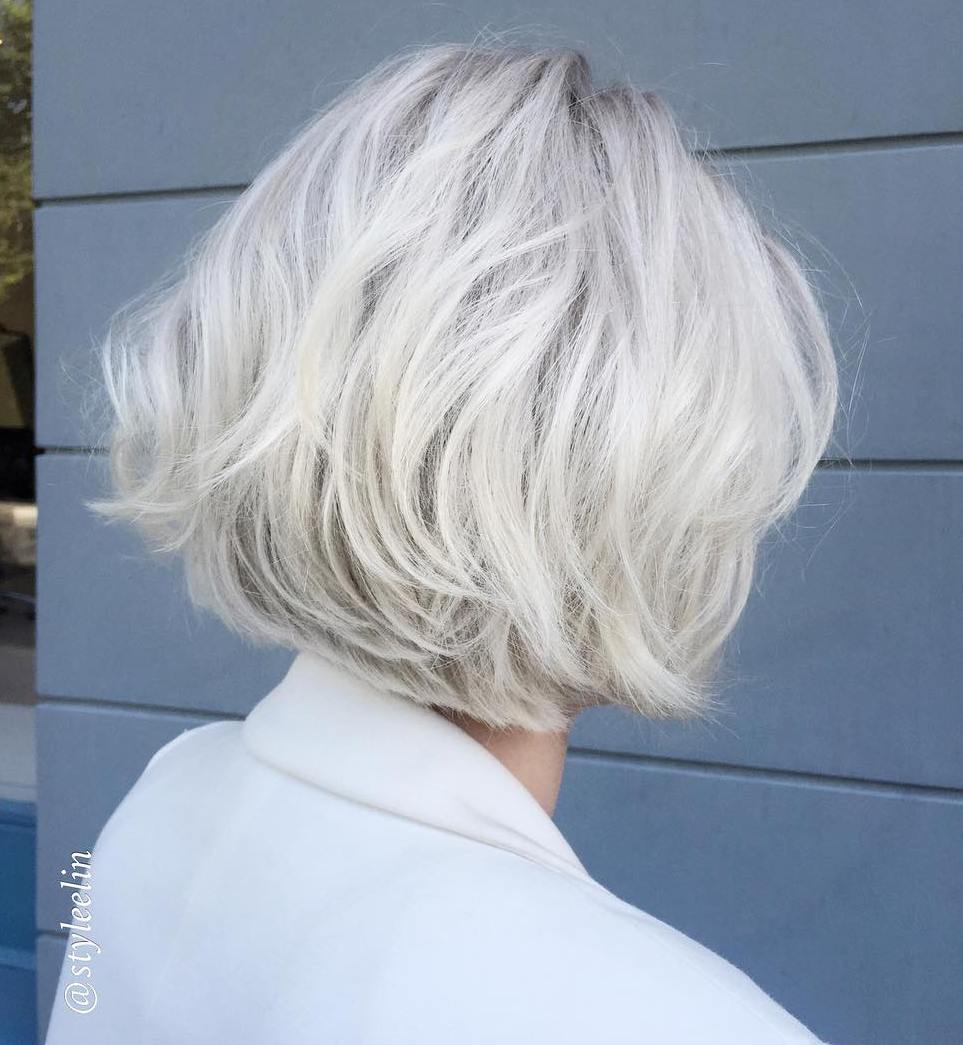 Effortlessly chic and oh-so-stylish! This tousled ash blonde bob is the perfect blend of sophistication and playfulness, making it a must-try for any modern trendsetter. 💁‍♀️✨