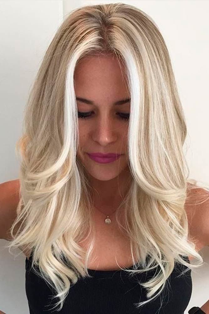 Radiating elegance and charm, this stunning blonde hairstyle perfectly blends sophistication with a playful touch. A timeless look for any occasion!