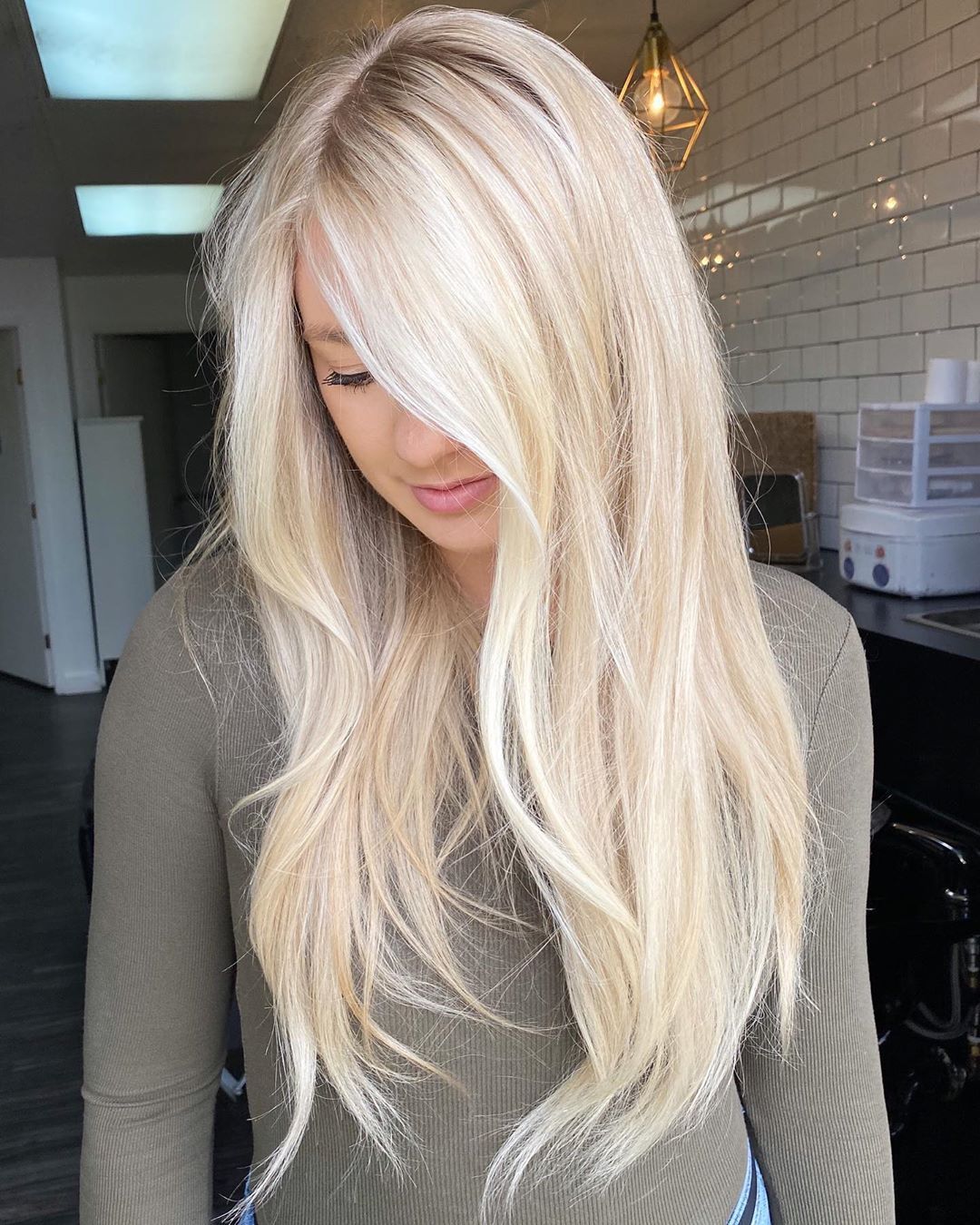 Effortlessly chic! This stunning blonde hairstyle perfectly blends elegance with a touch of playfulness, showcasing radiant layers that catch the light beautifully.