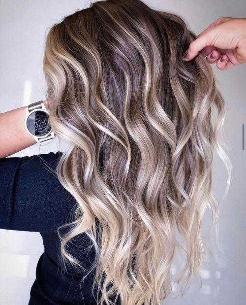 Embrace the elegance of this stunning blonde balayage, where cool tones blend seamlessly for a chic, modern look that radiates sophistication and style.