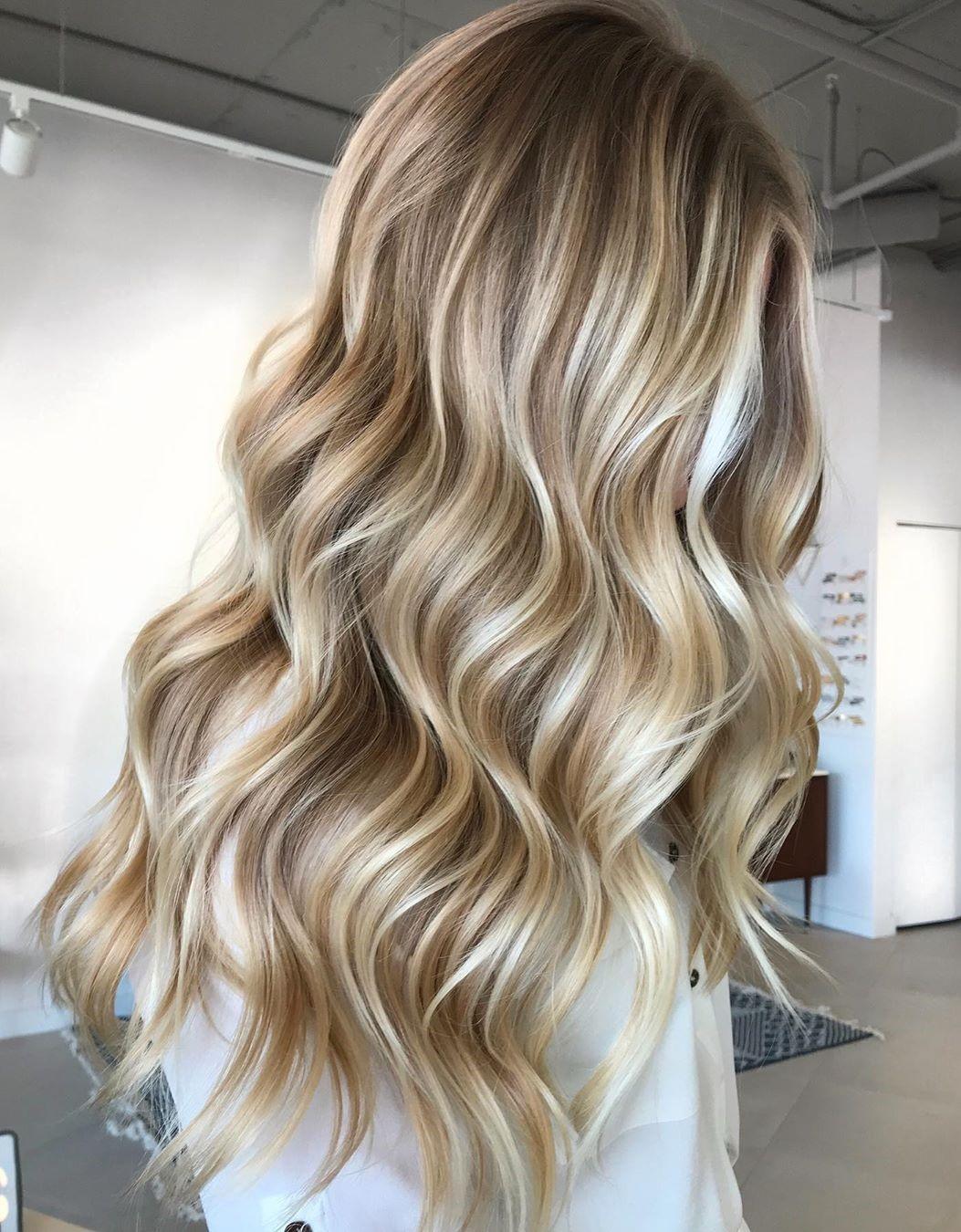 Embrace the elegance of long blonde locks with stunning highlights that add dimension and radiance. A perfect blend of sophistication and style!" ✨💁‍♀️ #BlondeHair #HairGoals