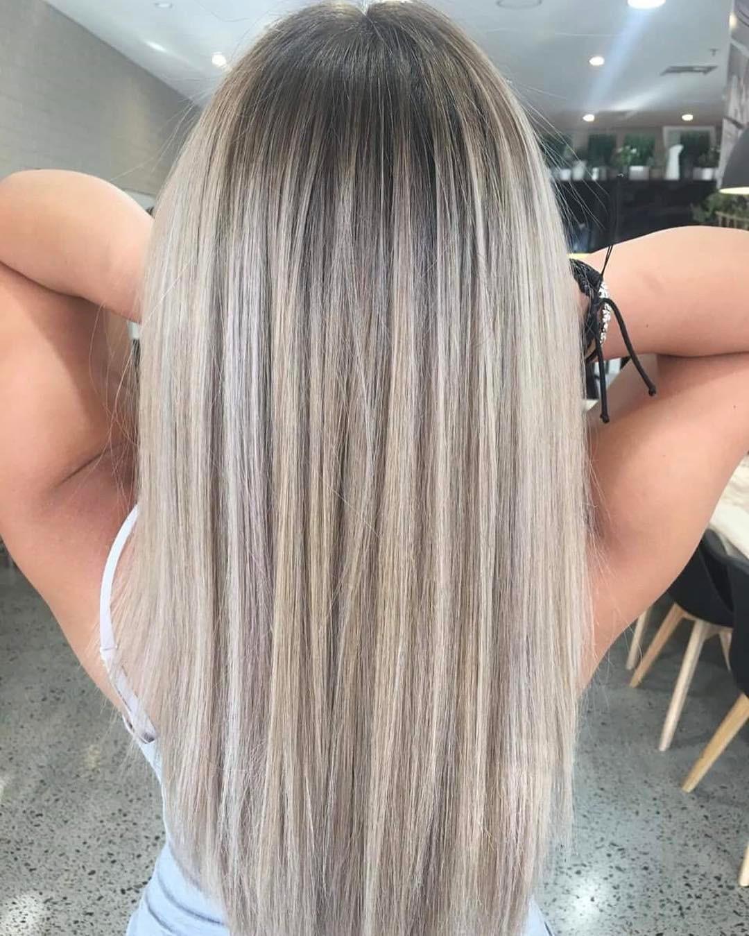 Embrace effortless elegance with this stunning ash blonde hairstyle—perfectly blending soft waves and a chic, modern vibe for a look that