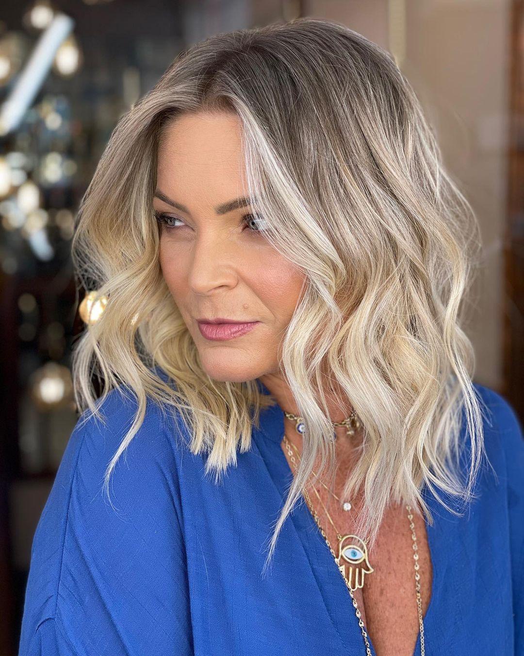 Embrace timeless elegance with this stunning blend of platinum highlights and soft lowlights, perfect for adding dimension and sophistication to any blonde hairstyle!" ✨💇‍♀️