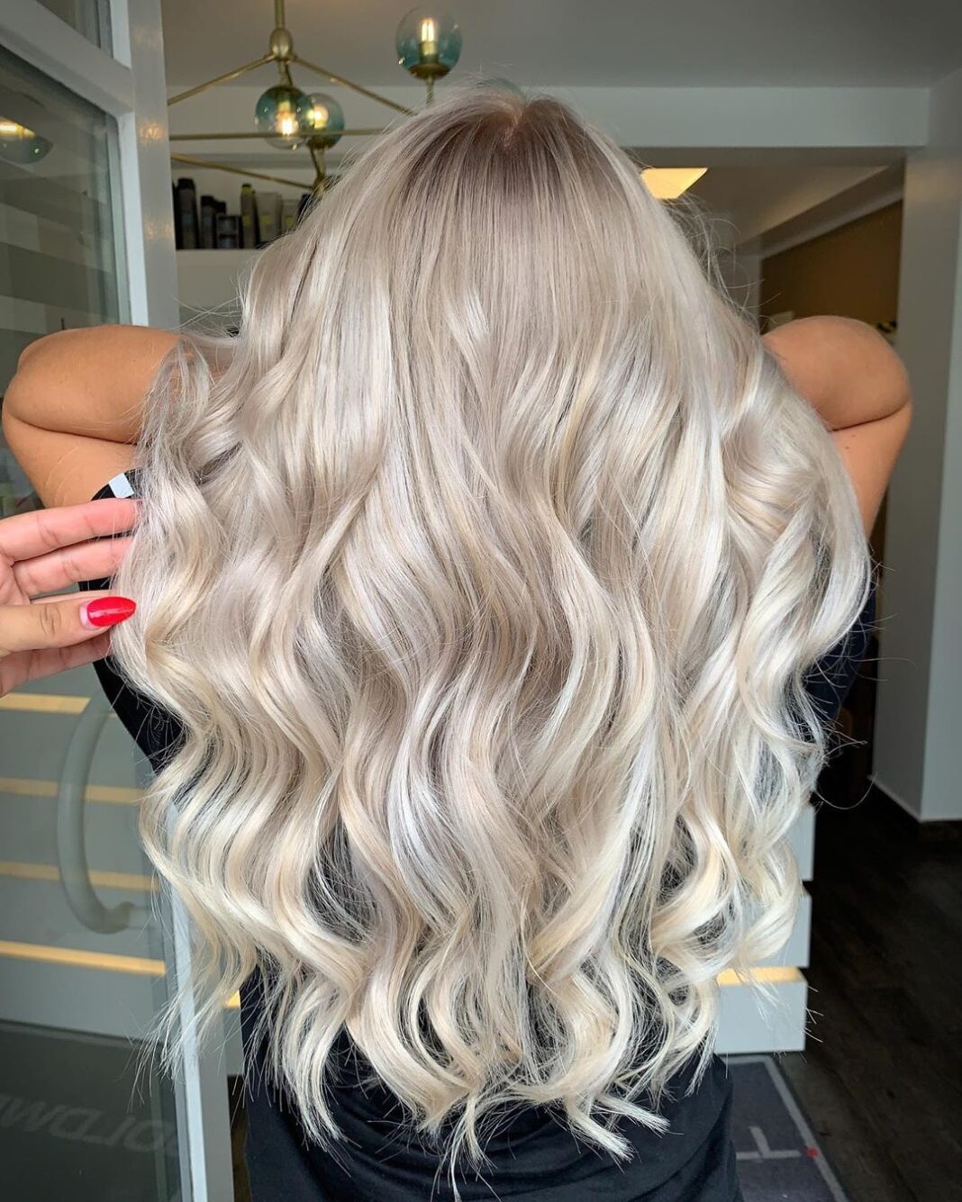 Embrace the glow with this stunning light blonde hairstyle, radiating elegance and effortless charm!" ✨💁‍♀️