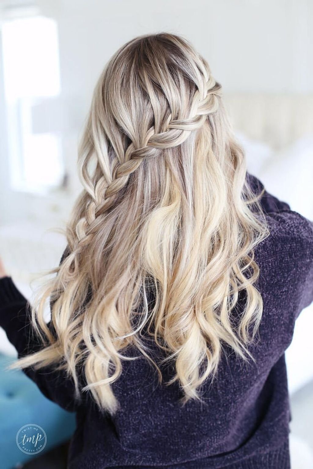 Embrace elegance with this stunning blonde hairstyle, blending soft waves and radiant color for a look that