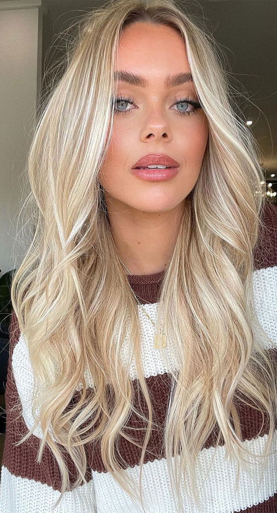 Radiating elegance and charm, this stunning blonde hairstyle perfectly blends effortless waves with a touch of glam. A timeless look that embodies both sophistication and carefree beauty!" ✨💁‍♀️ #BlondeHairGoals #HairInspo