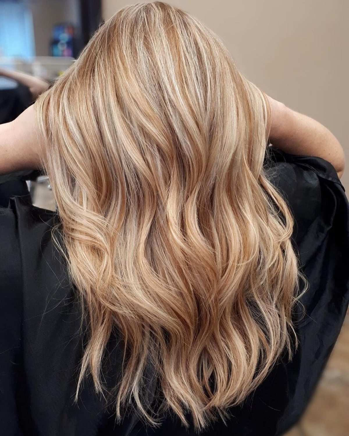 Embrace the warmth of strawberry blonde highlights that add a playful twist to light blonde locks. Perfect for a sun-kissed look!